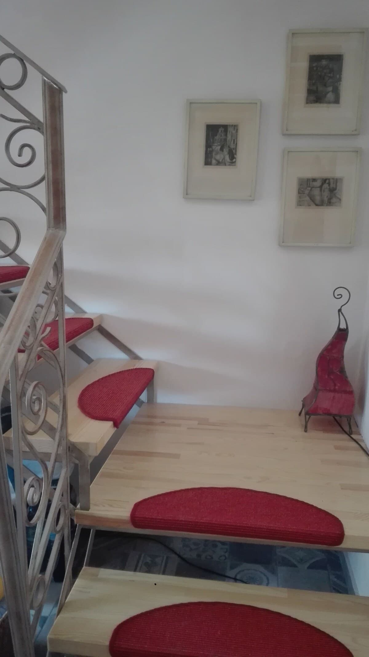 Staircase detail with art on walls